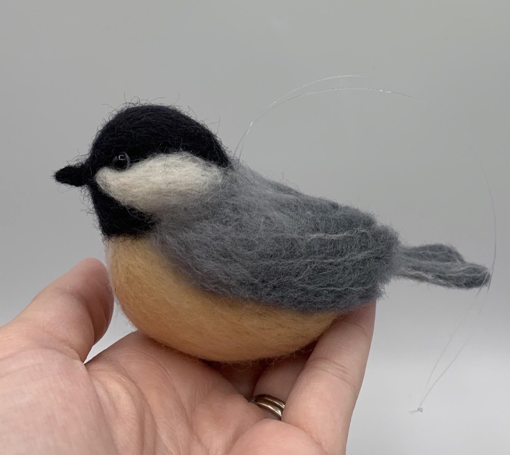 A felted chickadee made by a student in one of our fiber-arts workshops